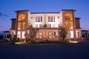 a large white building with trees in front of it at Best Western Premier Villa Fabiano Palace Hotel in Rende