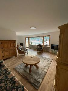 a living room with a table and a couch at Apartment Panoramablick in Bad Bergzabern