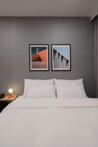 Postel nebo postele na pokoji v ubytování Object AanK Hotel Gumi