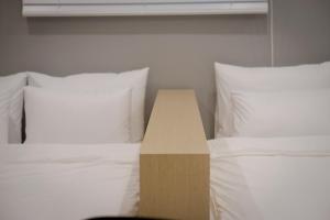 Postel nebo postele na pokoji v ubytování Object AanK Hotel Gumi