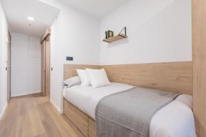 A bed or beds in a room at Micampus Santander Student Residence