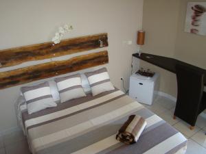 Postel nebo postele na pokoji v ubytování Hotel Ylang Ylang