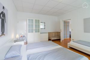 Postel nebo postele na pokoji v ubytování Spacious and modern furnished apartment for 10 guests