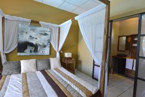 Postel nebo postele na pokoji v ubytování Hotel Ylang Ylang