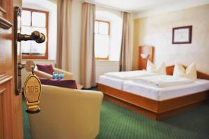 Postel nebo postele na pokoji v ubytování Hotel zum Bräu