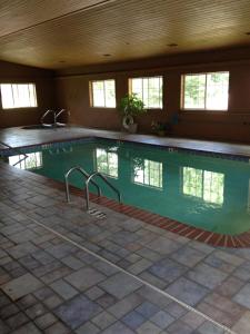 a large swimming pool in a house with at Hunter Lodge in Ripley