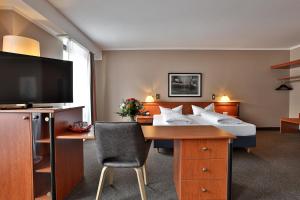 TV a/nebo společenská místnost v ubytování Hotel Quellenhof