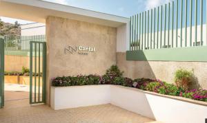 a entrance to a building with a sign on it at OCEAN APARTAMENT !! 1ª Línea del Mar, piscina, parking, wifi in Mojácar