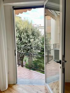 a sliding glass door with a view of a balcony at Giada uno in Treviso
