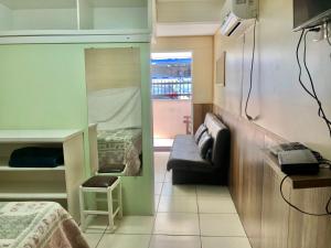 TV a/nebo společenská místnost v ubytování Kitnet no Centro de Bombinhas