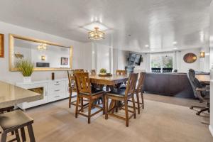 a dining room with a table and chairs at 2BD 2BA Condo with Hot Tub and Pool in Park City