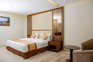 Giường trong phòng chung tại فندق لامير إن Lamer in Hotel