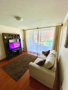 A seating area at Apartamento Alma Capital