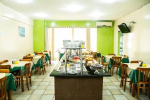 Ресторант или друго място за хранене в Cidade Verde Flat Hotel