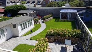 an aerial view of a backyard with a garden at Design Apartments Haus Noge in Westerland (Sylt)
