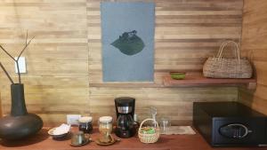 a kitchen counter with a coffee maker and a blender at Bosque Guardian Lodge in Tarapoto