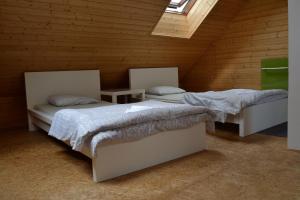 Postel nebo postele na pokoji v ubytování Horský hotel Anděl