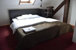 Postel nebo postele na pokoji v ubytování Horský hotel Anděl