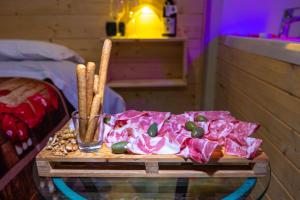 a table with a tray with meat and vegetables on it at Hotel Sirio in Boscotrecase +47 photos