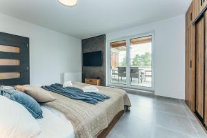 Postel nebo postele na pokoji v ubytování Premium apartman Lipno