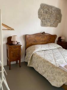 Postel nebo postele na pokoji v ubytování B&B La Corte del Segrino
