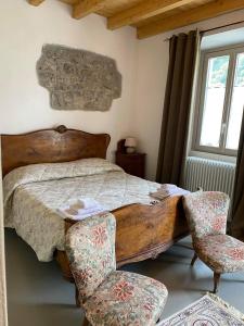 Postel nebo postele na pokoji v ubytování B&B La Corte del Segrino
