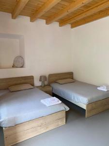 Postel nebo postele na pokoji v ubytování B&B La Corte del Segrino