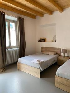 Postel nebo postele na pokoji v ubytování B&B La Corte del Segrino