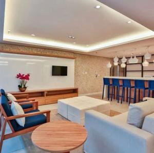 Khu vực ghế ngồi tại Flat Apart Hotel América Campos dos Goytacazes