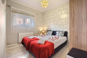 Posteľ alebo postele v izbe v ubytovaní Apartamenty Perła Szczyrku