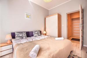 Posteľ alebo postele v izbe v ubytovaní Apartamenty Perła Szczyrku