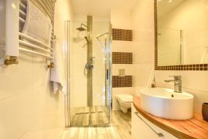 Kúpeľňa v ubytovaní Apartamenty Perła Szczyrku + 36 fotografií
