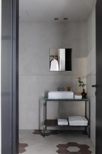 a bathroom with a sink and a mirror at Agriturismo Olmo in Sondrio +45 photos