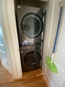 a washing machine in the corner of a room at Ocean Front condo in the heart of Hampton Beach in Hampton
