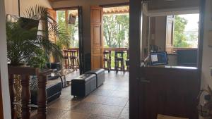 a door to a restaurant with a laptop on the counter at Hotel Trujillo Plaza in Trujillo