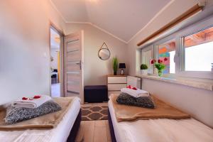 Posteľ alebo postele v izbe v ubytovaní Apartamenty Perła Szczyrku