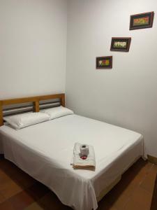 Een bed of bedden in een kamer bij Hotel Trujillo Plaza