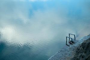 a body of water with a sign in the water at Apartamentos Los Telares in Hermigua