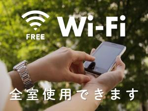 a person holding a cell phone in their hands at Hotel Route-Inn Miyazaki Tachibana Dori in Miyazaki +28 photos