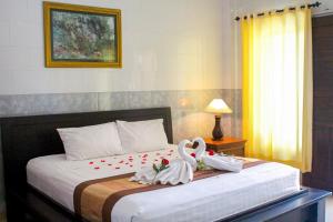 Postel nebo postele na pokoji v ubytování Putu Guest House 2