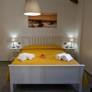 A bed or beds in a room at La Terrazza Azzurra