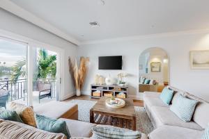 a living room with a couch and a table at Brightwater Blue in Clearwater Beach