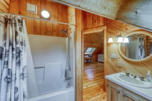 a bathroom with a shower and a sink and a mirror at Log Cabin with a View in Andover +58 photos