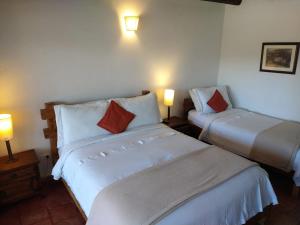 Ένα ή περισσότερα κρεβάτια σε δωμάτιο στο Hotel Mesón de los Virreyes