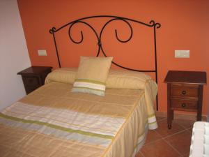 En eller flere senge i et værelse på Alojamientos Bellavista