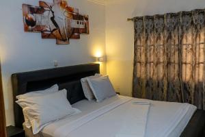 Postel nebo postele na pokoji v ubytování MICASO Guest House
