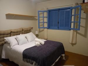 Cama ou camas em um quarto em Paraíso da Mantiqueira são Francisco Xavier sp