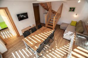 an overhead view of a living room with stairs at Apartments Izvir in Bohinj