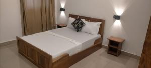 Ein Bett oder Betten in einem Zimmer der Unterkunft AZURIA HOTEL