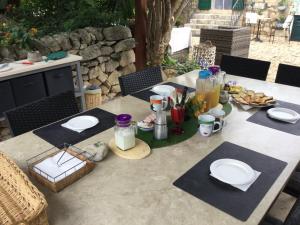 a table with plates of food on top of it at Oasi di Campagna in Modica